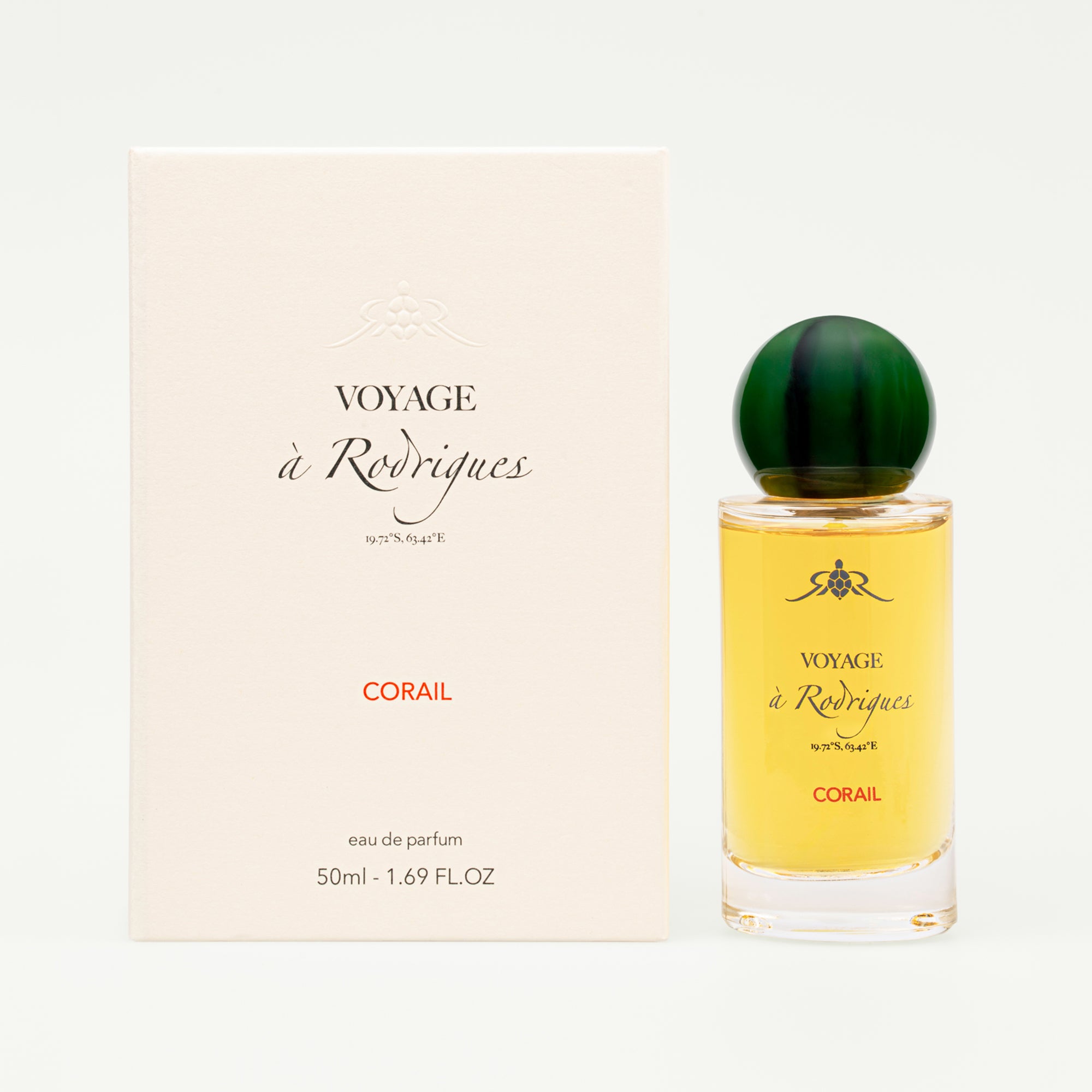 Perfume bottle and packaging of 'Voyage a Rodriques' Corail on a white background