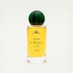 Perfume bottle with yellow label and green cap on a white background