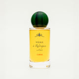 Perfume bottle with yellow label and green cap on a white background