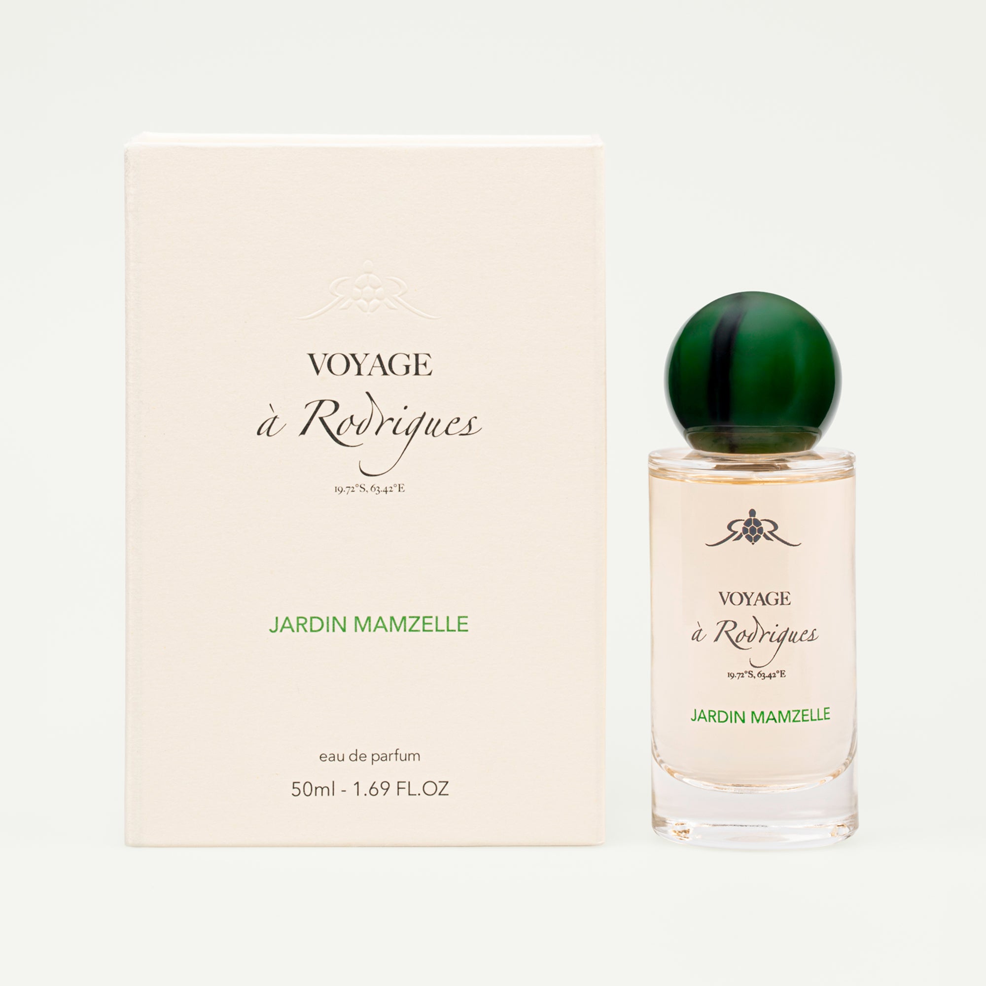 Perfume bottle and packaging of 'Voyage a Rodriques' on a white background