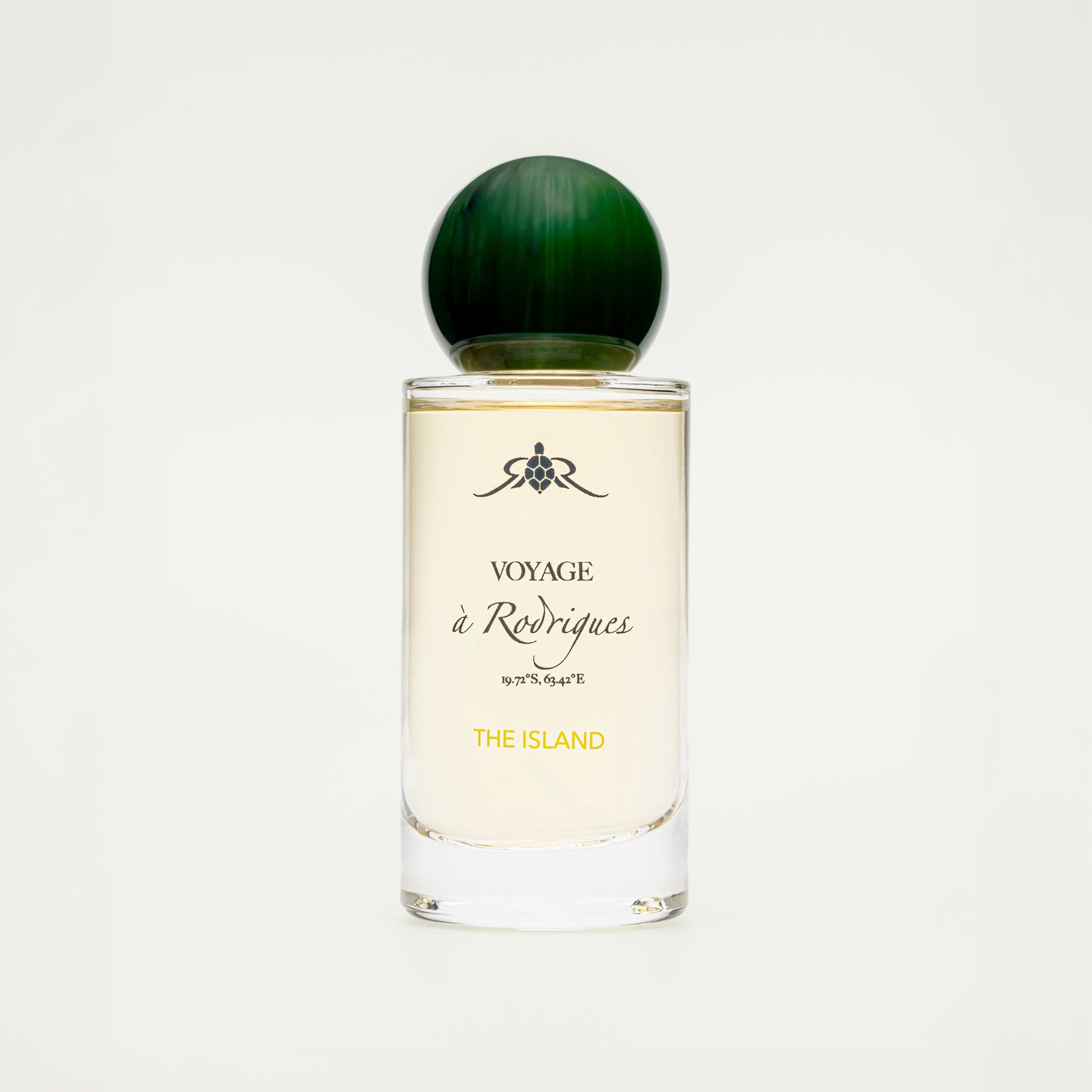 Perfume bottle labeled 'Voyage a Rodrigues The Island' on a white background